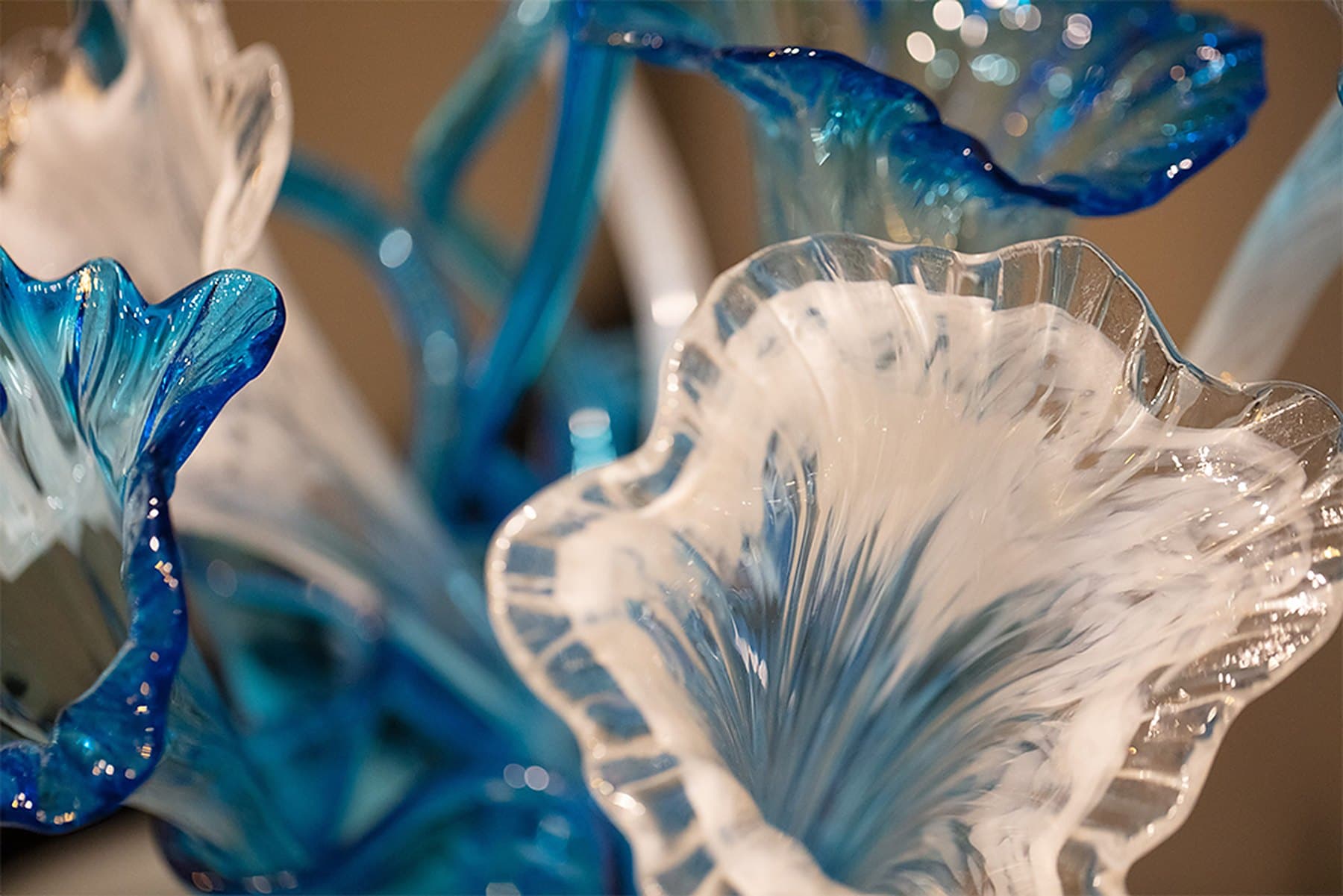 Blown glass sculpture in blue and white in the Acqua Blu Medical Spa lobby