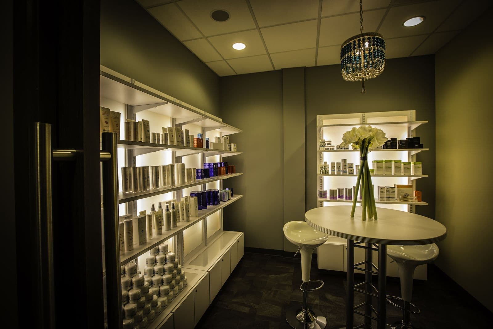 The Wexford skincare room, product shelves lit from behind